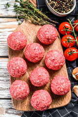 Raw meatballs made from ground beef. White background. Top view