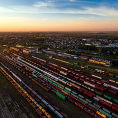 Aerial view of the railway junction with freight trains at sunset, Radviliskis, Lithuania