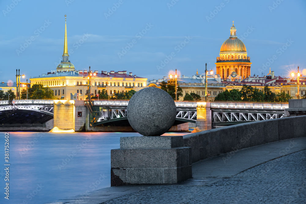 Wall mural Granite stone ball on Vasilyevsky island, St Isaac's Cathedral and the Admiralty on the background, famous landmarks, St Petersburg, Russia