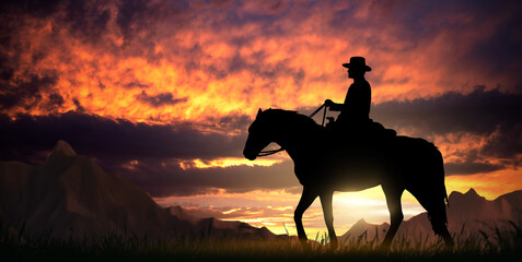 Cowboy on a horse at sunset © ginettigino
