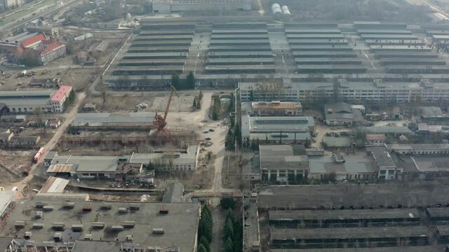 Drone aerial video of destroyed plant and storage in the city. Destructed area.