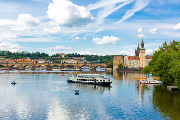 Naklejka premium The landscape of the city of Prague view from the Vltava river on the ancient architecture of the city