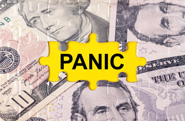 Puzzle with the image of dollars in the center of the inscription -PANIC