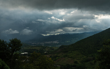 Fototapeta na wymiar dramatic stormy skies over the caribbean mountains, in the dominican republic at sunset. 