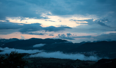 dramatic image of mountain landscape in the caribbean town of Ocoa, Dominican Republic. during sunset, cloudy skies.