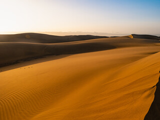 Obraz na płótnie Canvas dunes of maspalomas at sunrise