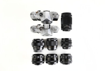 Two old 35 mm SLR camera , released 70's with vintage lenses on white background.