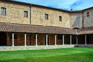 Courtyard with cloisters of a historic monastery in the city of Massa Maritima