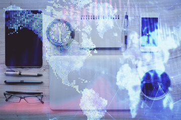 Double exposure of forex graph hologram over desktop with phone. Top view. Mobile trade platform concept.
