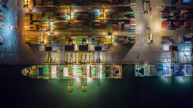 Time lapse Container , container ship in export and import business and logistics. Shipping cargo to harbor by crane. Water transport International. Aerial view and top view.