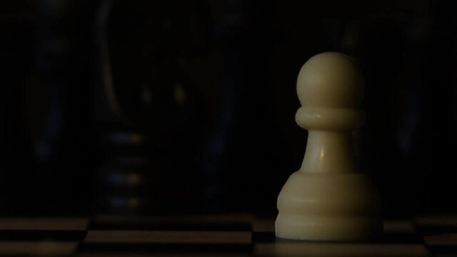 The concept of a street protest on a chessboard. Police flashing light. Social problems.