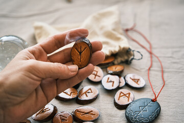 in the girl's hand are wooden runes