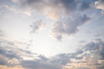 Beautiful evening sky. Scenic sky background. Warm sky with delicate clouds