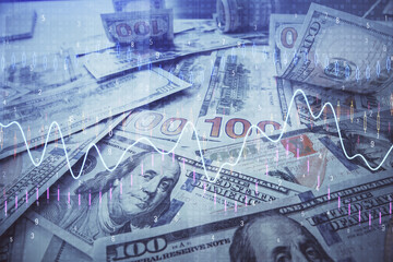 Multi exposure of forex chart drawing over us dollars bill background. Concept of financial success...