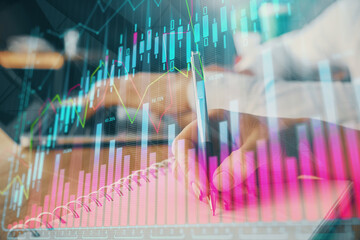 Double exposure of forex chart drawing over people taking notes background. Concept of financial analysis