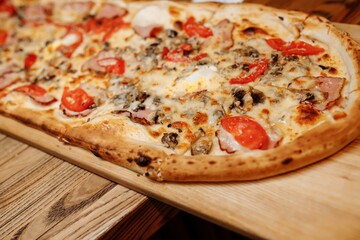 Pizza on wooden table top view. Fast food. Post blog social media. with copy space. Pizza ready to eat