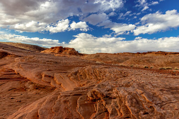 Blue sky , rolling clouds and the sandstone layers of rock, The Chains, Page, Arizona, USA