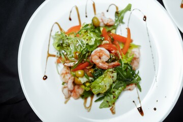 Green salad with shrimps. Healthy seafood meal