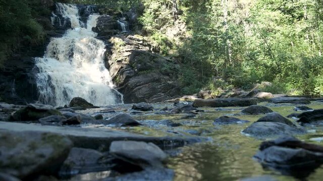 Scenic view with focus change on mountain waterfall in Karelia, Russian North. Jukankoski or White Bridges waterfall on river Kulismayoki.