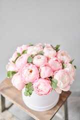 Pink peonies in pink round box. Beautiful peony for catalog or online store. Floral shop concept. Flowers delivery