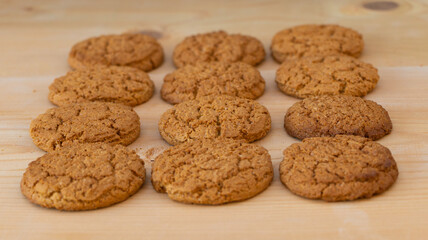 Tasty biscuits on wooden background close up