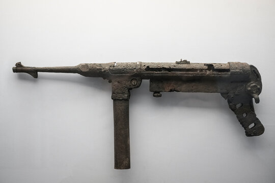 mp40 german machine gun hand isolated on a white background. machine gun manual  during the Second World War. rusty machine gun and bent gun barrel