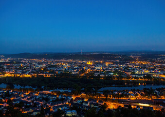 Fototapeta na wymiar Night shot of the illuminated old German city of Trier, photographed from a hill