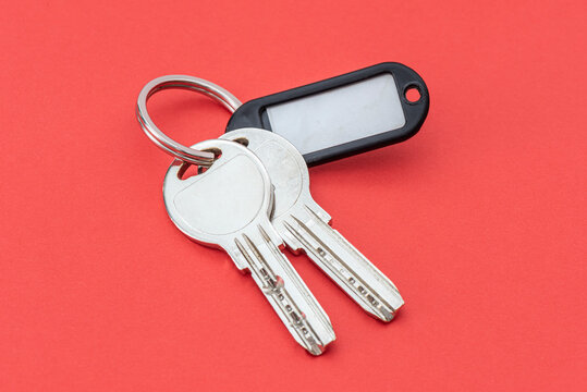 Close-up of keys on the red background.