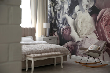 Beautiful floral photoart work used as wallpaper in bedroom interior