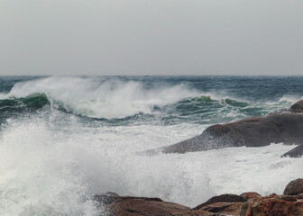 waves crashing on rocks during a storm in the Atlantic Ocean