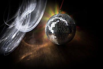 Colorful disco mirror ball lights night club background. Party lights disco ball. Selective focus