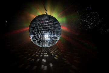 Colorful disco mirror ball lights night club background. Party lights disco ball. Selective focus