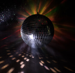 Colorful disco mirror ball lights night club background. Party lights disco ball. Selective focus