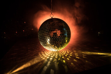 Colorful disco mirror ball lights night club background. Party lights disco ball. Selective focus