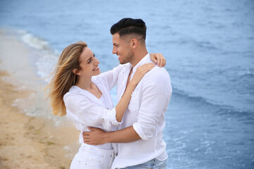 Happy couple on sea beach. Romantic walk