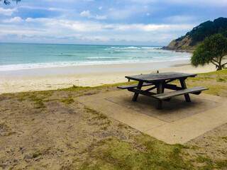 Fototapeta na wymiar beach with wooden bench