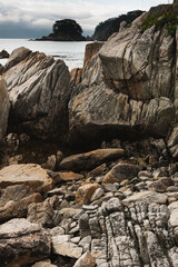 Cloudy summer day on the sea with a rocky shore coastline of the Bay.