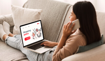 Asian girl using laptop, browsing online make up store