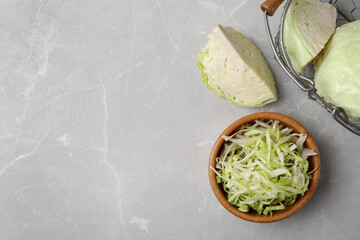 Fresh cut cabbage on light table, flat lay. Space for text
