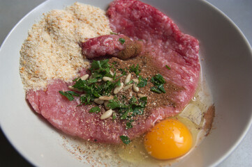 Flat lay of the ingredients to make homemade meatballs