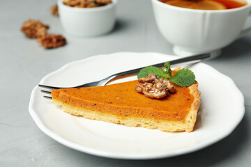 Piece of fresh homemade pumpkin pie on table