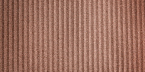 Wall paper design. Brown corrugated sheet of cardboard as background