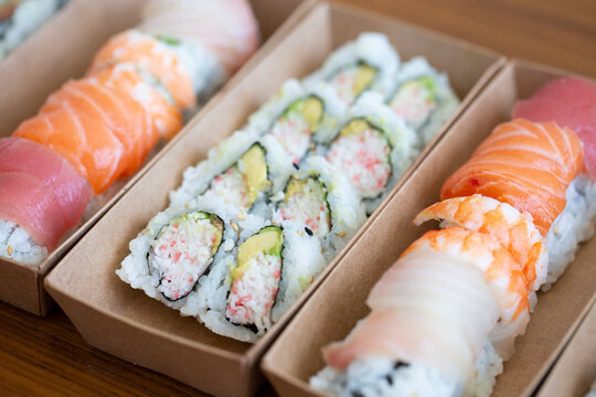 California Rolls And Sushi Rolls In Paper To Go Boxes