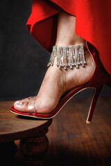 Shimmery high heel stiletto shoe on a red carpet