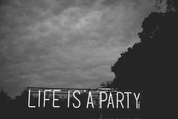 neon sign that says: Life is a party.