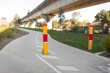 Parking space protector. Yellow and red path way bollards.