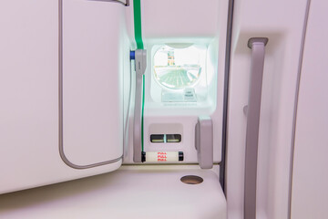 Closeup of Emergency exit on an aircraft, view from inside of the plane.
