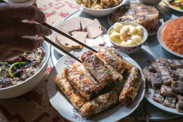 A traditional Vietnamese meal for lunar new year Tet holiday in spring, placed on new flowered sedge mat, on the last day of the last year