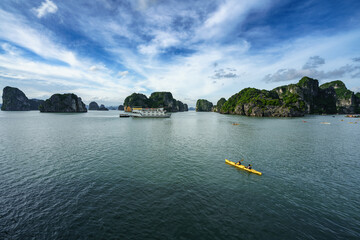 Halong bay in Vietnam, UNESCO World Heritage Site, with paddling kayak.