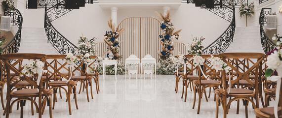 Beautiful decorations for wedding ceremony room with flower and chair for guest